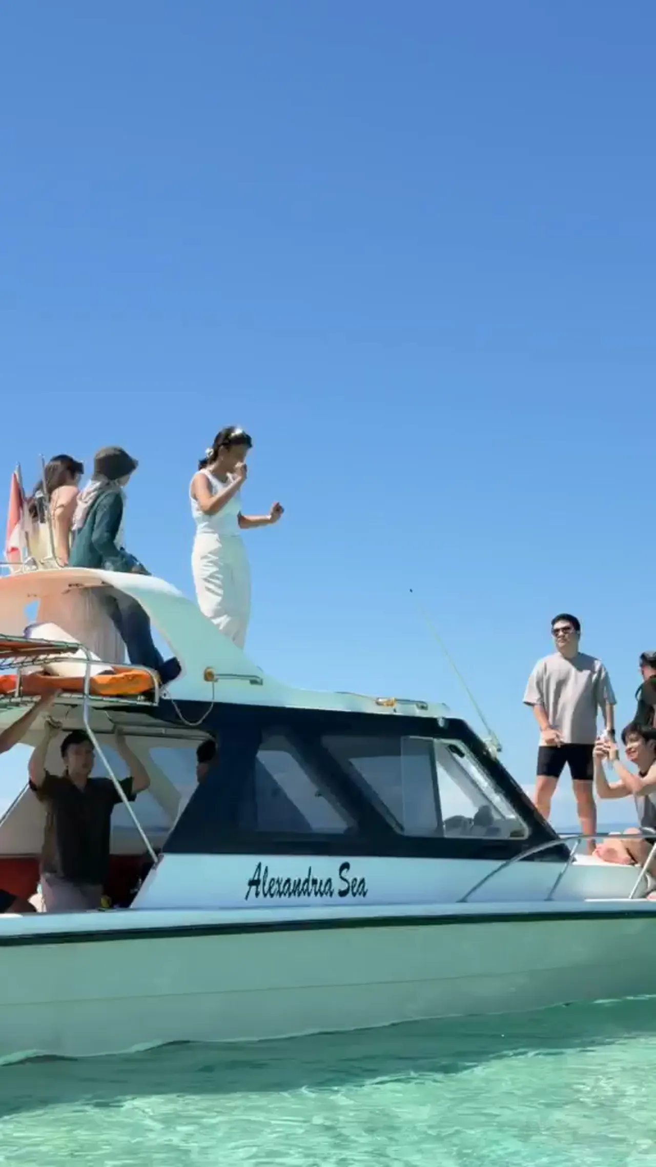 Guests boarding from a shallow-water boat stop video